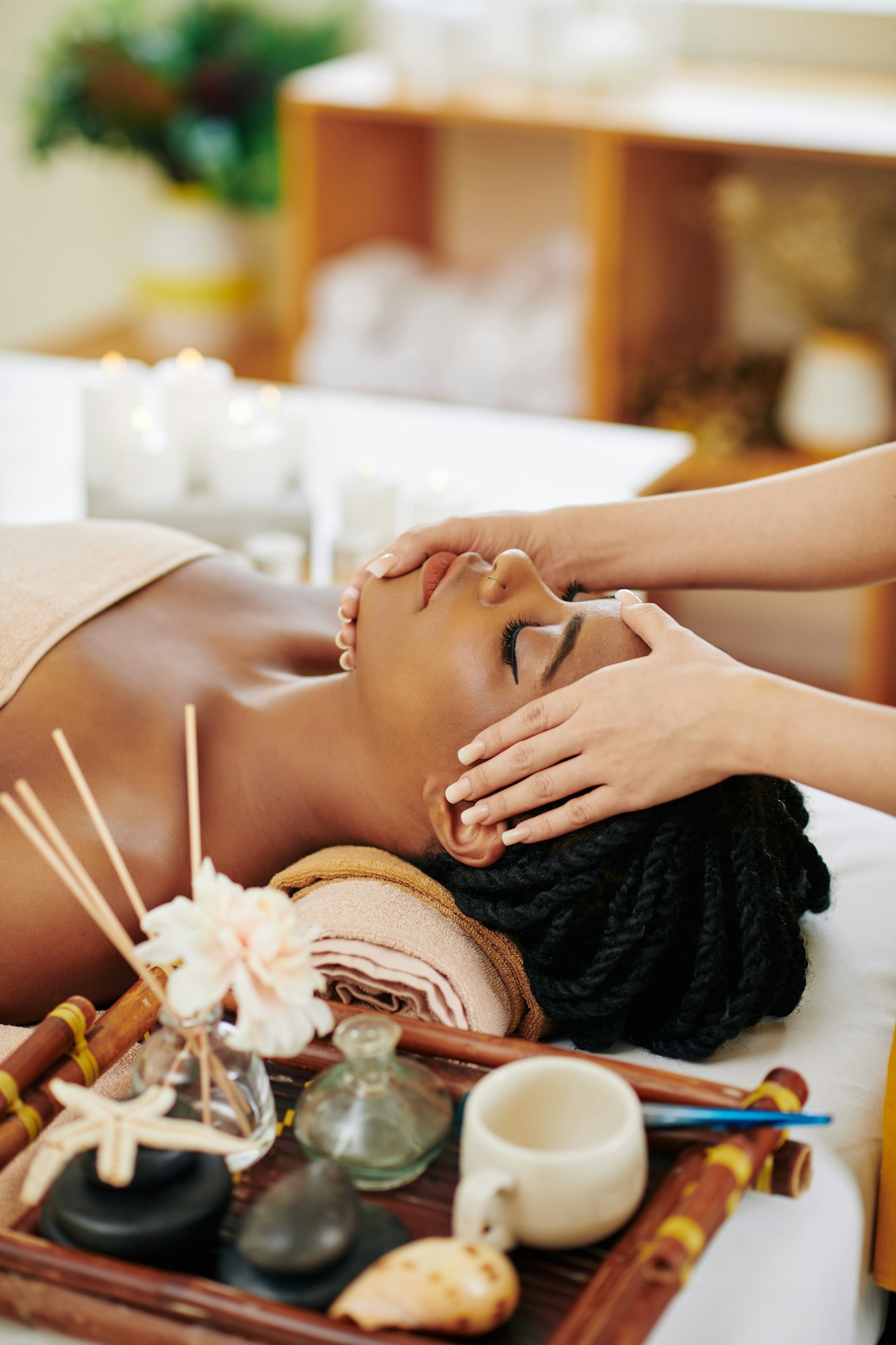 Woman getting face and head massage